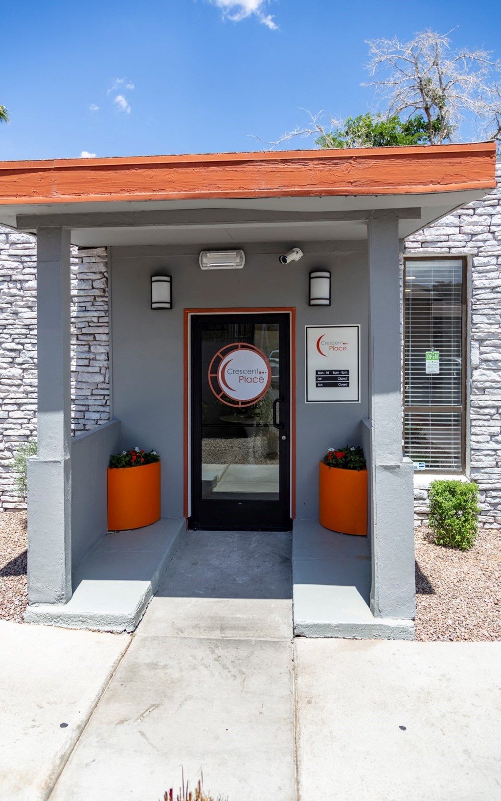 the front door of a building with a no smoking sign on it