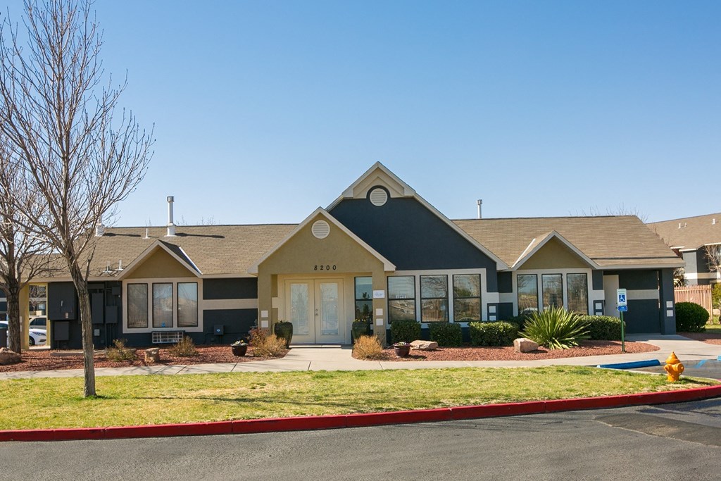 a house with a yard and a fire hydrant in front of it