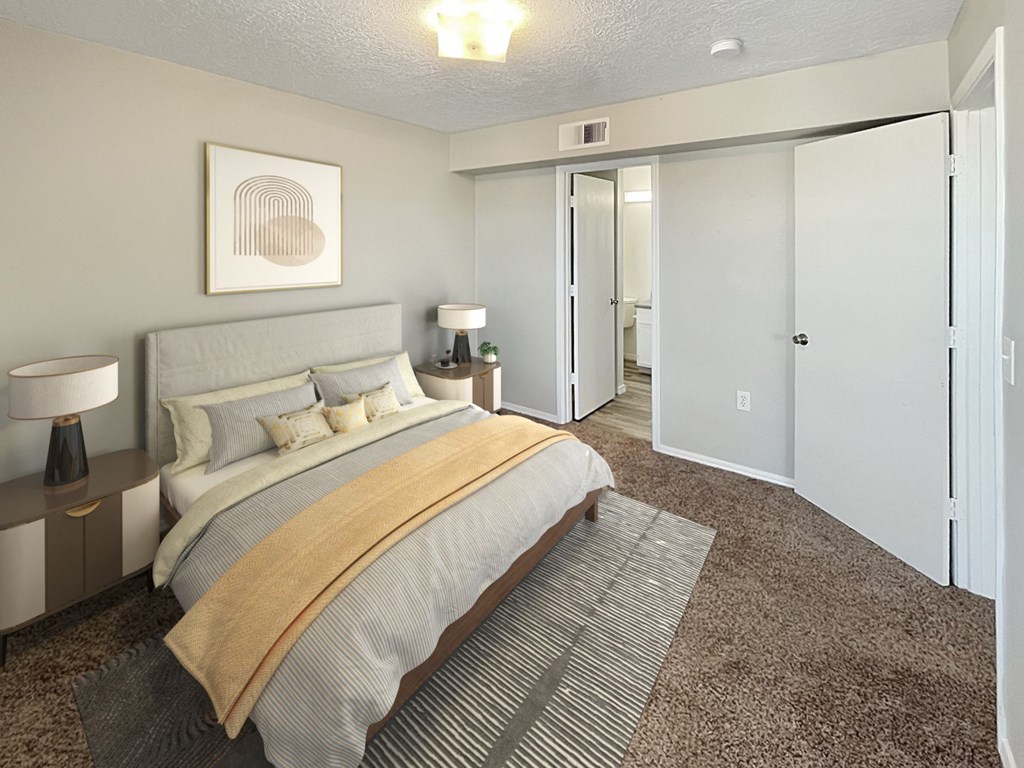 a bedroom with a large bed and a closet