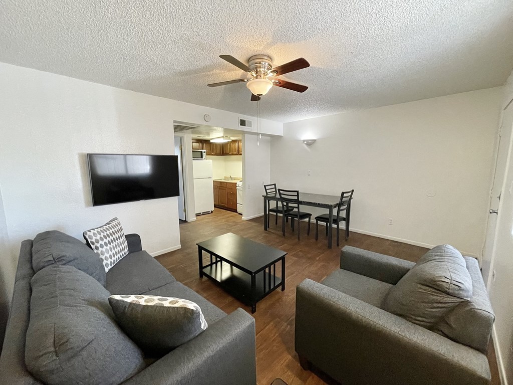 a living room with a couch and a tv