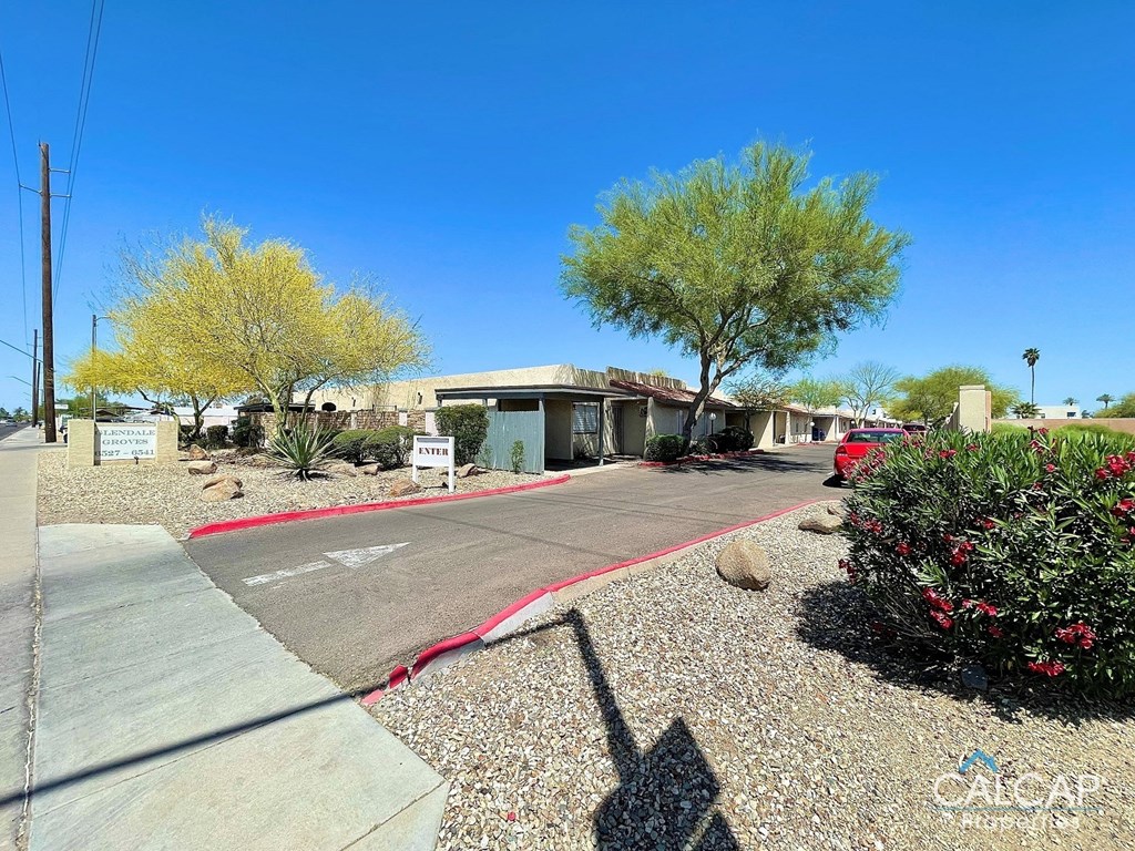 a house with a driveway and a street in front of it