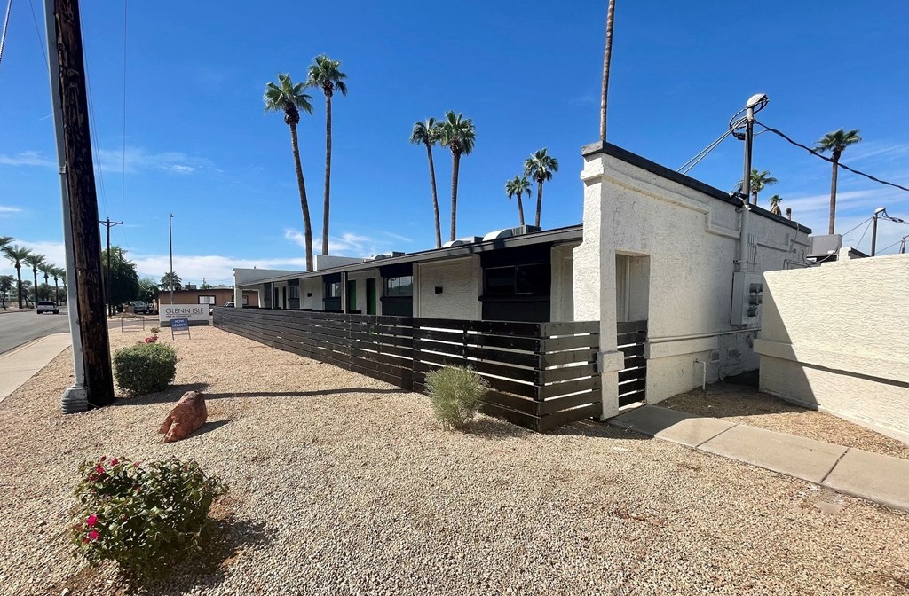 the building where the motel is located is shown with palm trees