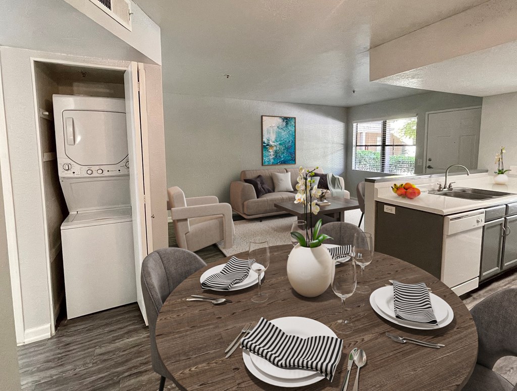 a kitchen and dining room with a table and chairs