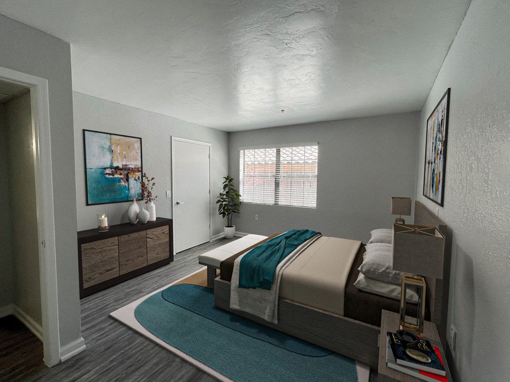 a bedroom with a bed and a rug