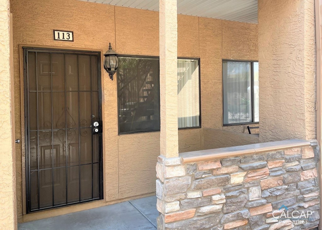the front door of a building with a black door