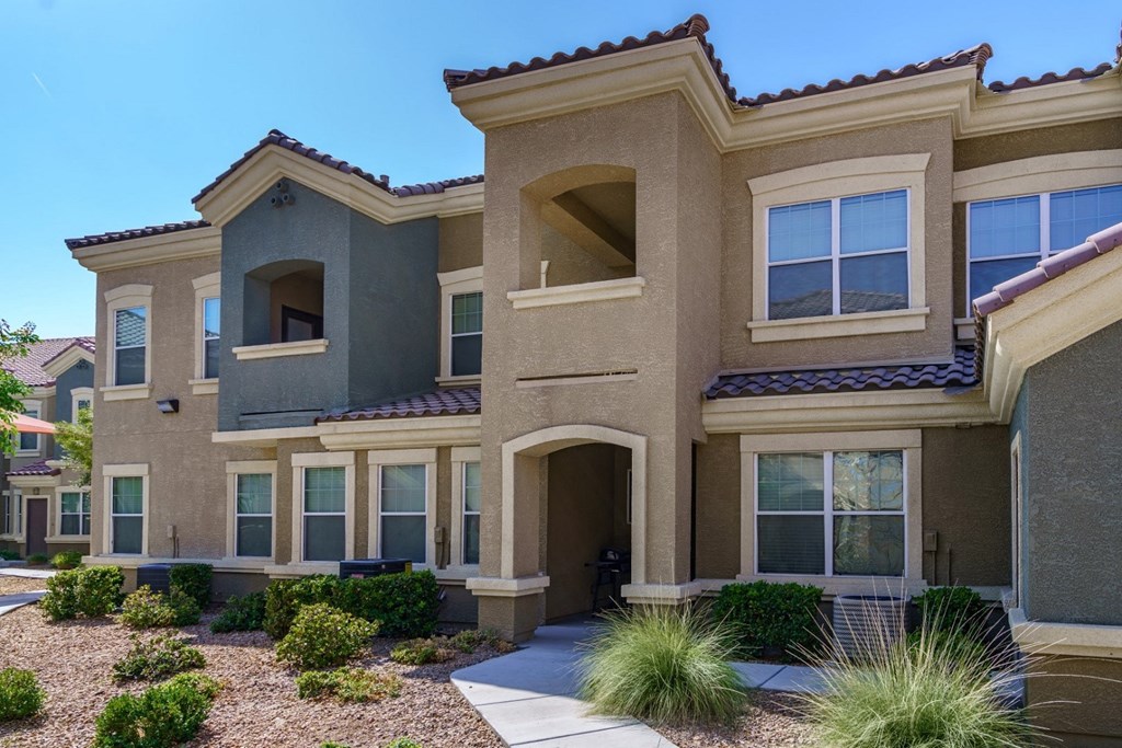 a house with a sidewalk in front of it