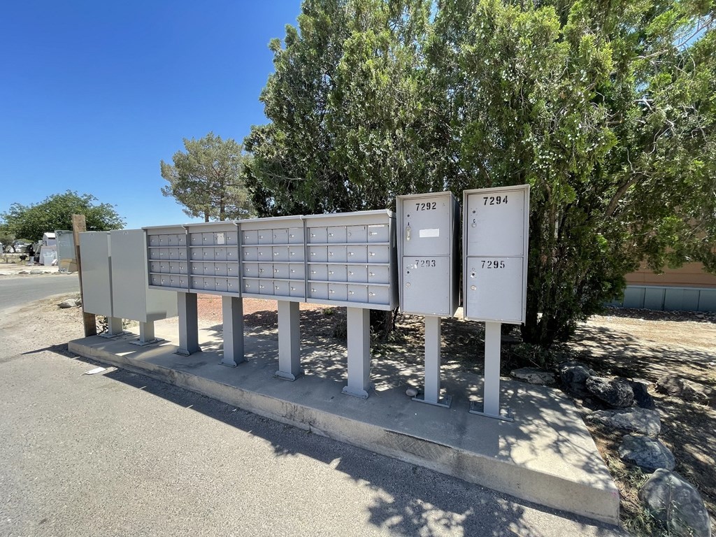 a row of mailboxes on the side of a street