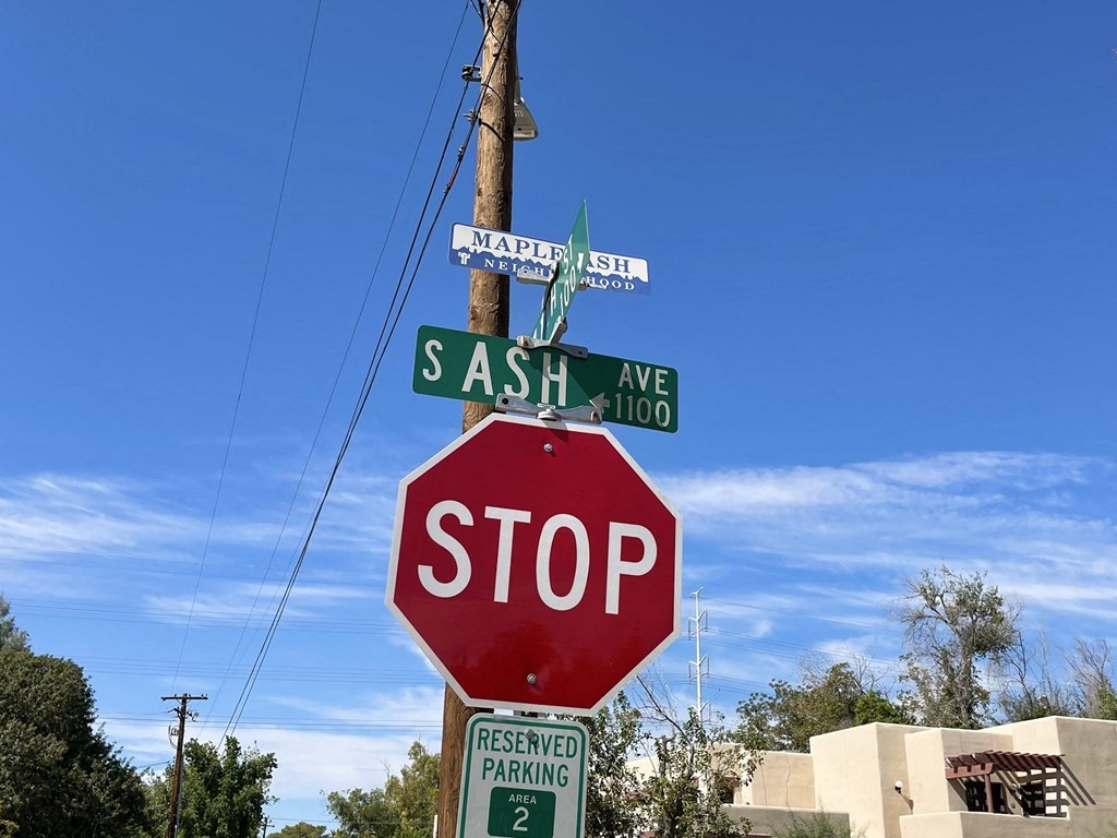 a stop sign with street signs on top of it