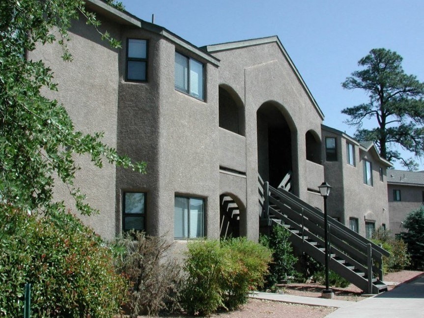 the exterior of a building with stairs and a stairwell