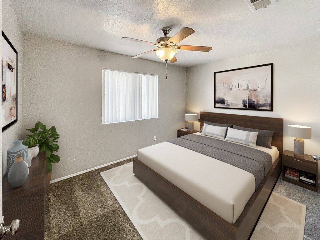 a bedroom with a bed and a ceiling fan