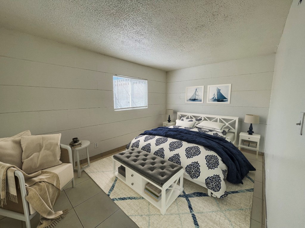 a bedroom with a bed and a white chest of drawers