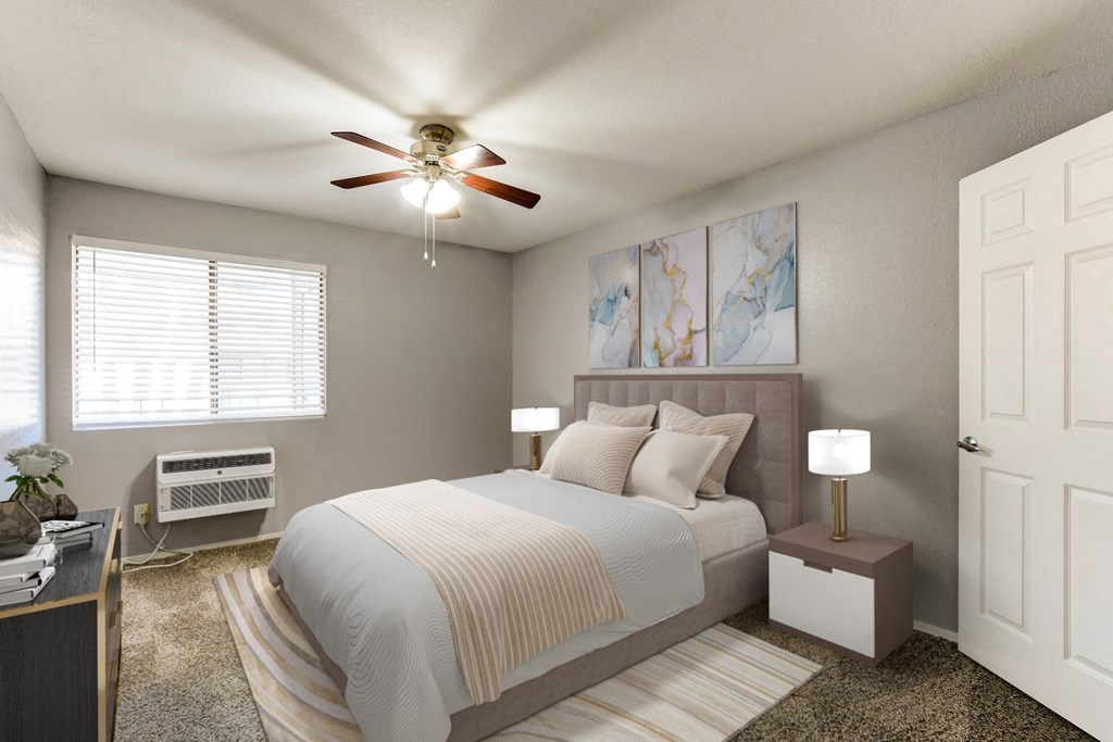 a bedroom with a bed and a ceiling fan