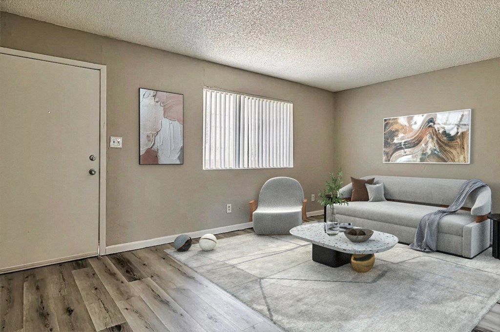 a living room with a couch chair and coffee table