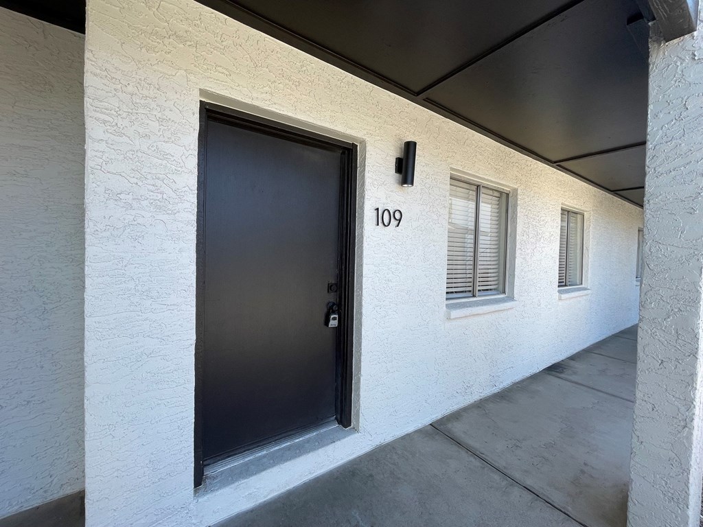 a black door on a white building