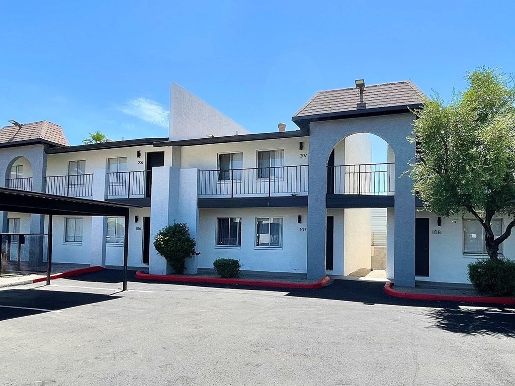 a large parking lot in front of a building