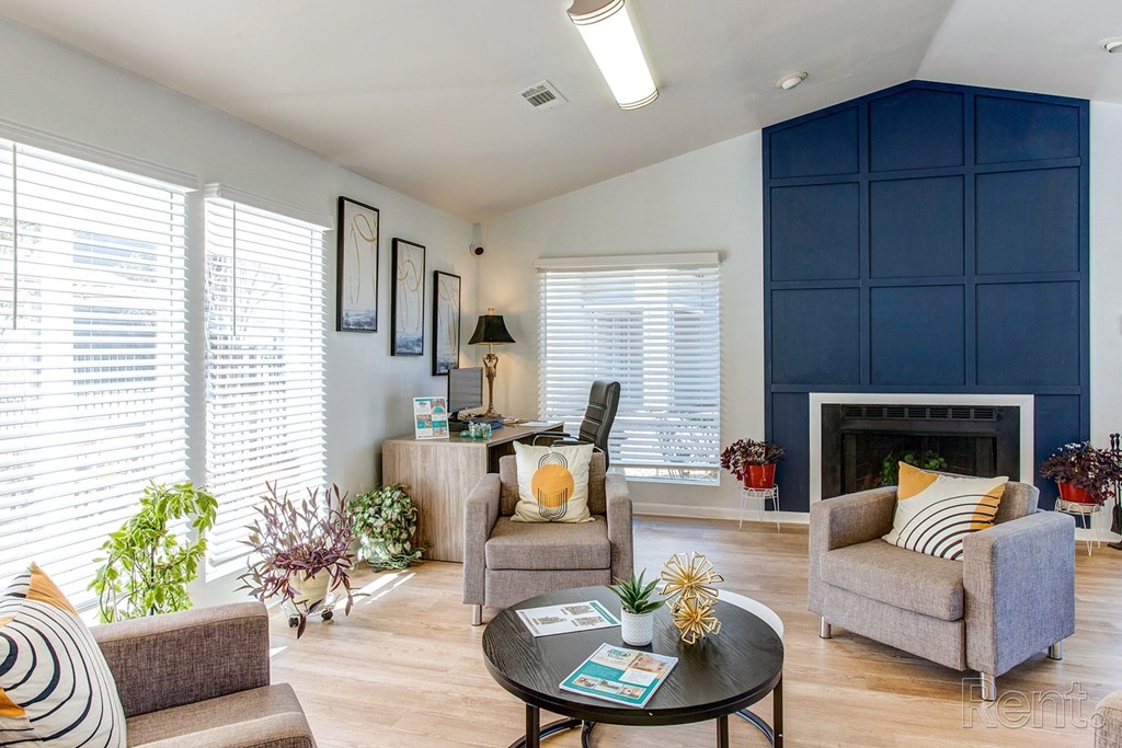 a living room with blue walls and a fireplace