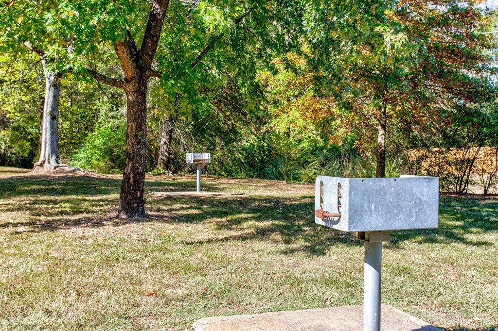 a mailbox on a pole in a park