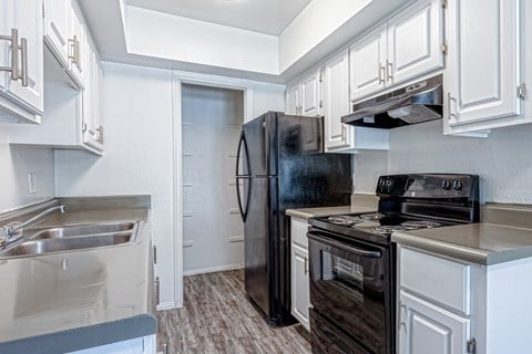 the preserve at ballantyne commons apartment kitchen with stove refrigerator and sink