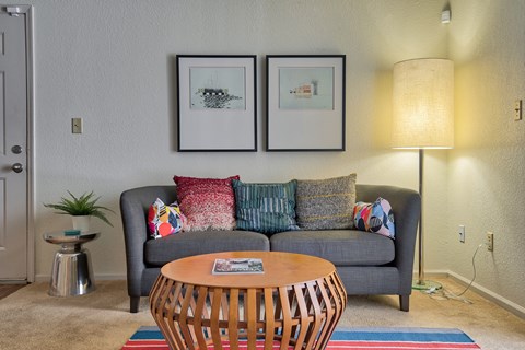 a living room with a couch and a coffee table