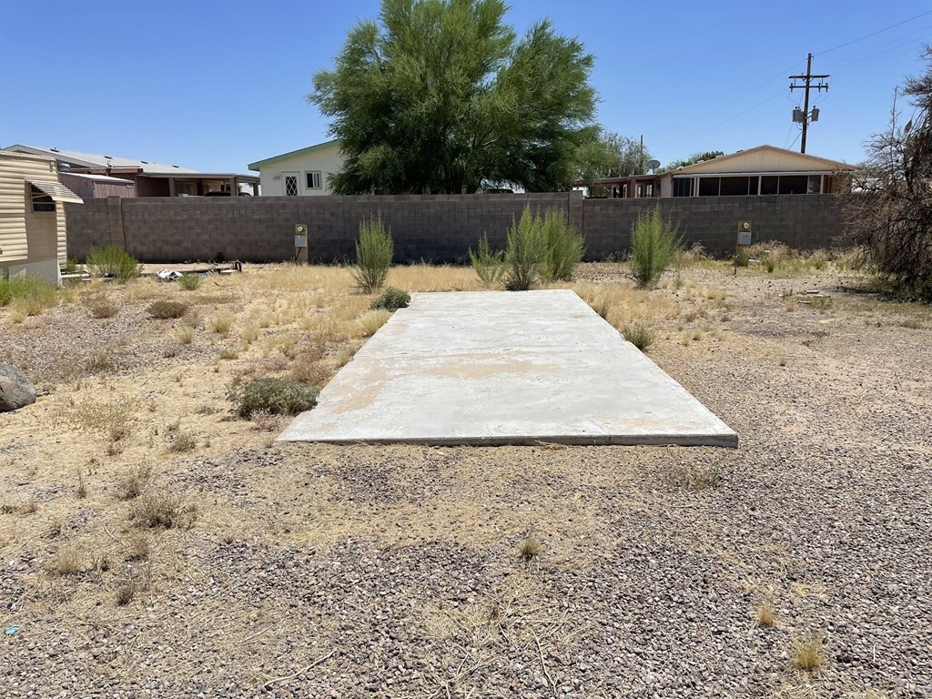 a concrete slab in the ground in front of a house