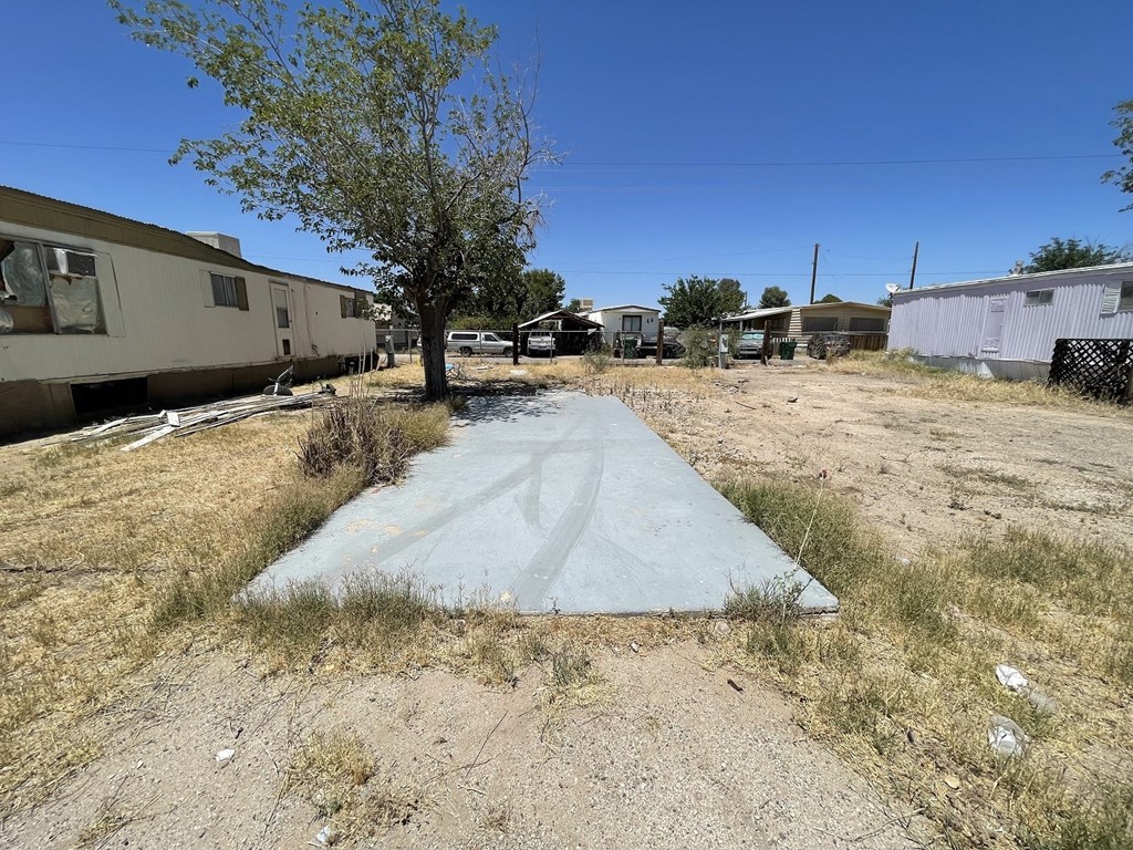 a concrete walkway leading to a trailer park