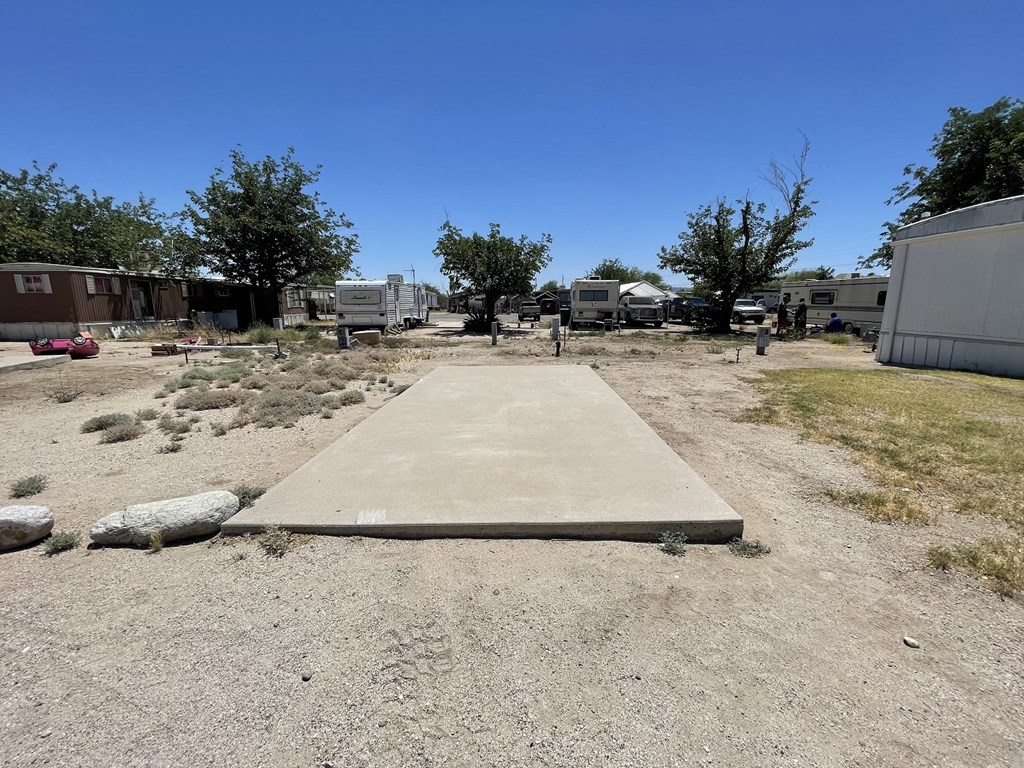 a concrete ramp on the ground in a trailer park