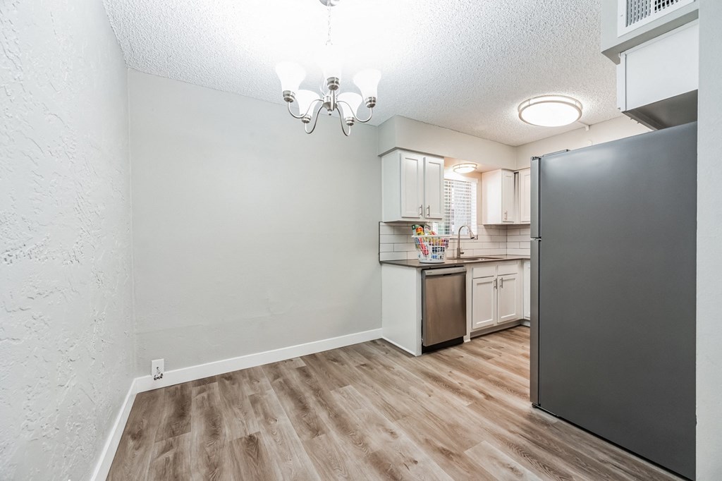 a kitchen and dining area in a 555 waverly unit