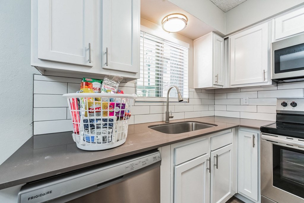 a small kitchen with a dishwasher and a sink