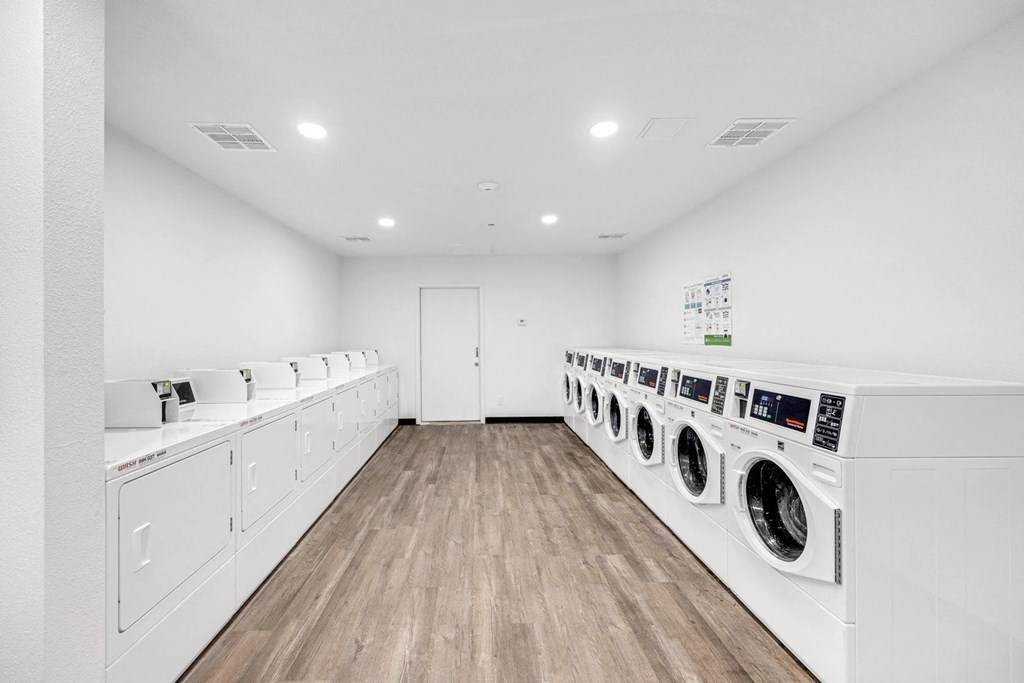 the preserve at ballantyne commons laundry room with washes and dryers