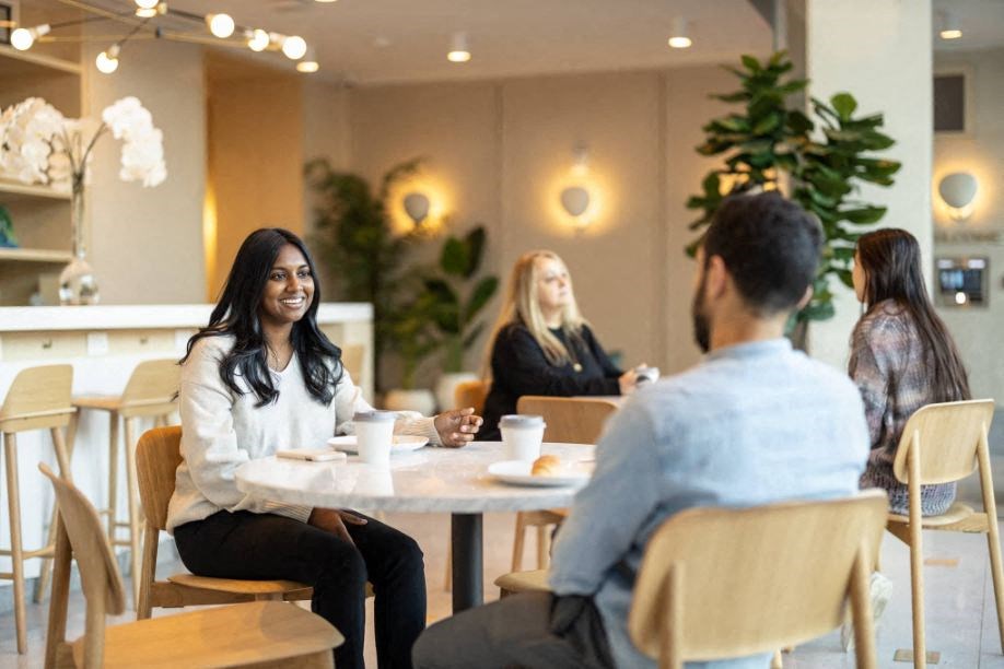 people sitting around a table in a restaurant