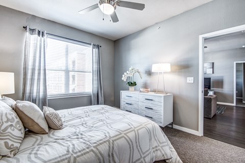 a bedroom with a bed and a ceiling fan at Republic at Alamo Heights, Texas, 78209