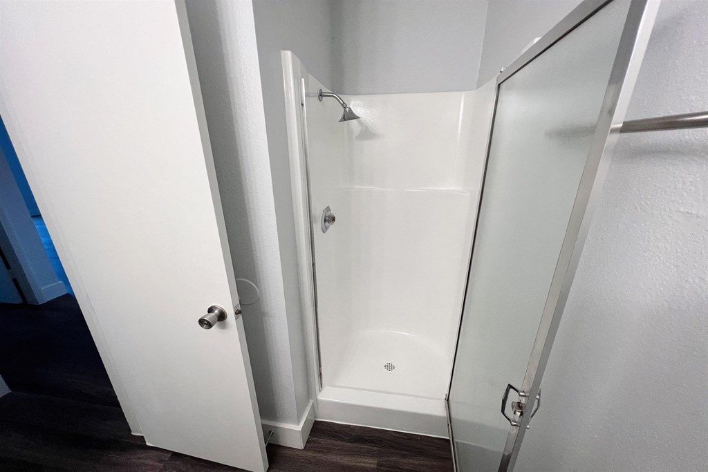 a bathroom with a shower and a sliding glass door at Northchase, Austin, TX, 78753