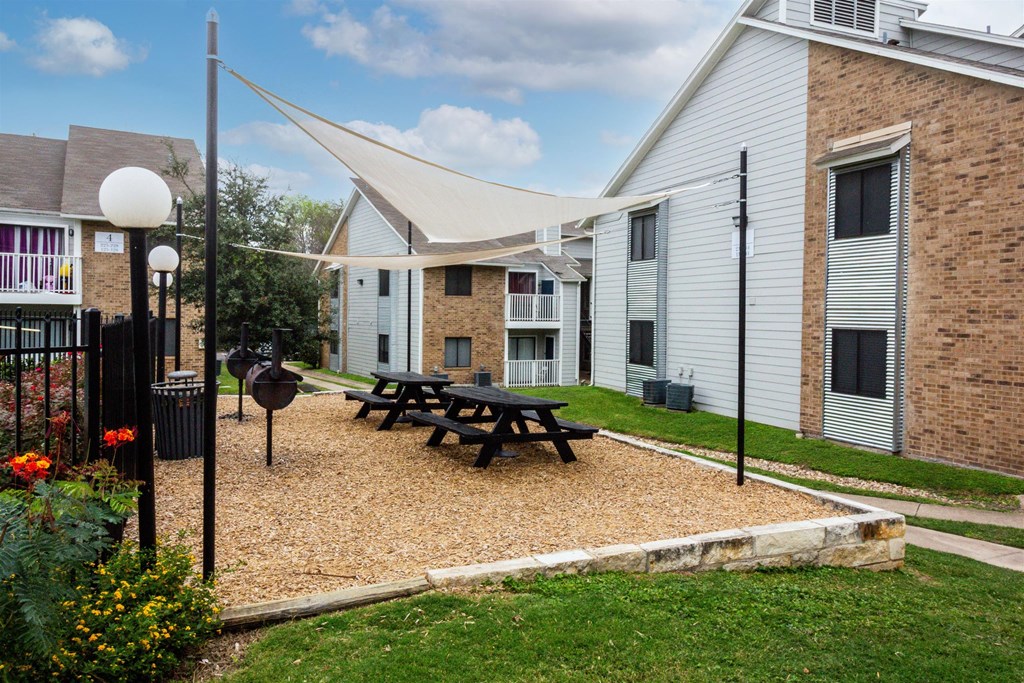 our apartments have a courtyard with a picnic table and a grill at Northchase, Austin, TX