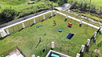 an aerial view of a childrens play area in a yard at The Fitzroy San Marcos, San Marcos, Texas