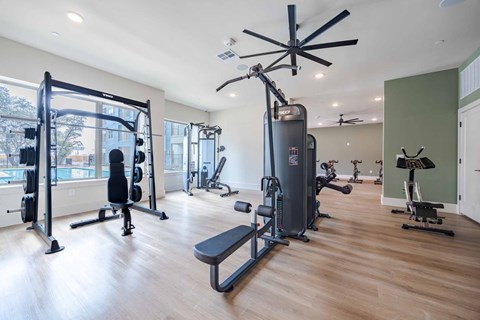 Fitness center with strength training equipment at Emilia Apartments, Boerne