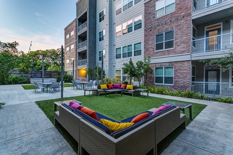 an outdoor lounge area at the bradley braddock road station apartments