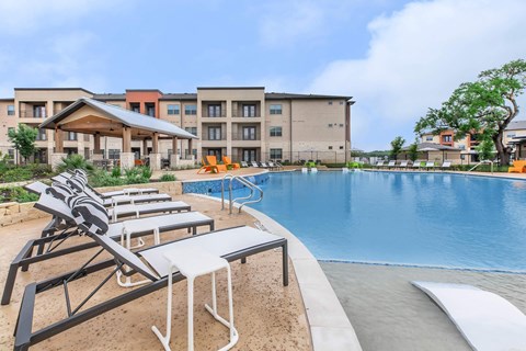 Resort style pool with covered pavilion and lounge seating at Sienna at Westover Hills Apartments, San Antonio, Texas