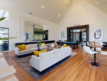 the living room is open to the dining room and kitchen at The Fitzroy San Marcos, Texas
