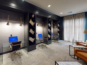 a conference room with desks and chairs and a window at The Fitzroy San Marcos, San Marcos, Texas