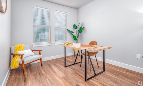 Room with wooden table at The Landings at Brooks City-Base, San Antonio, 78235