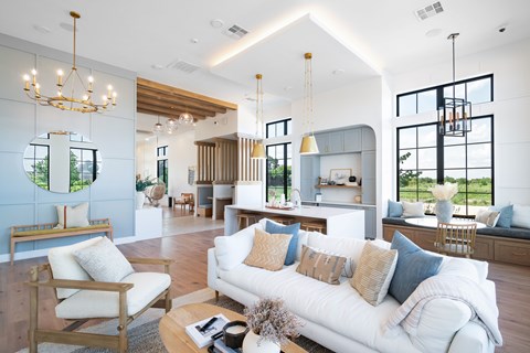 A living room with a white couch and a coffee table.