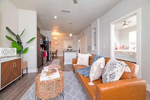 a living room with a couch and a coffee table at The Landings at Brooks City-Base, San Antonio, TX, 78235
