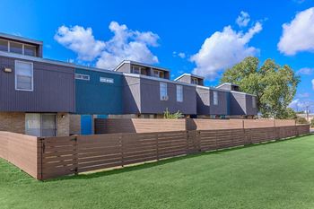 a house with a fence in front of it