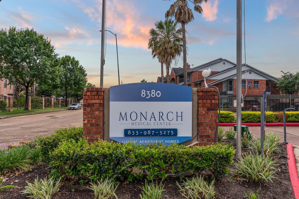 A sign for Monarch Medical Center is displayed in front of a building.