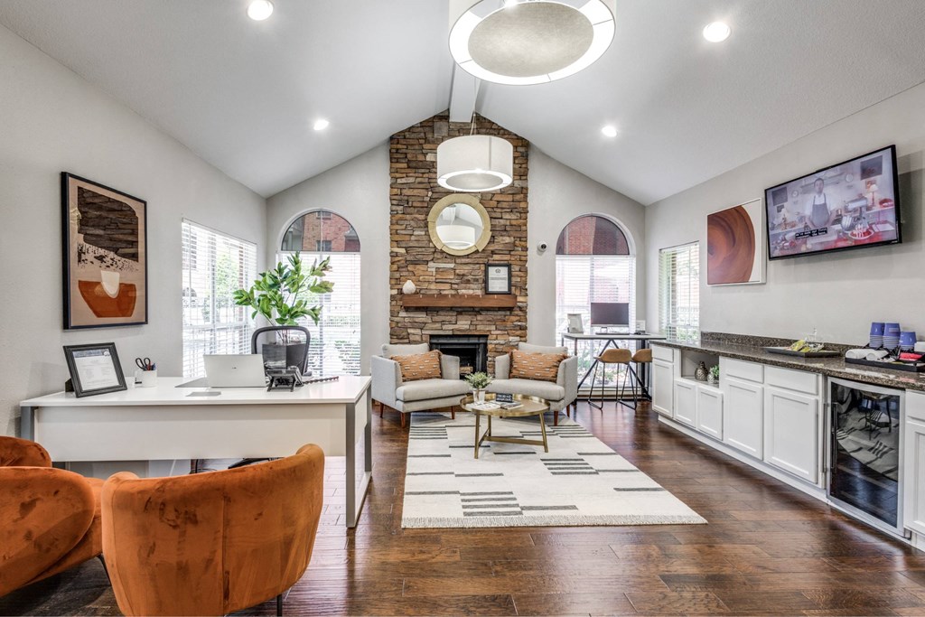 A modern living room with a brick fireplace and a television.