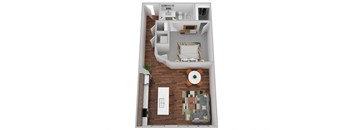 A top down view of a living room with a couch, coffee table, and kitchen area.