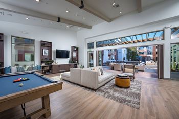 Aurora Clubhouse with pool table, ample seating, and TV
