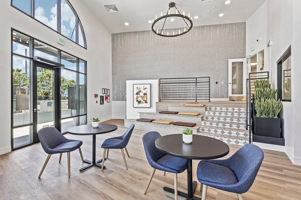 A dining area with a table and chairs.
