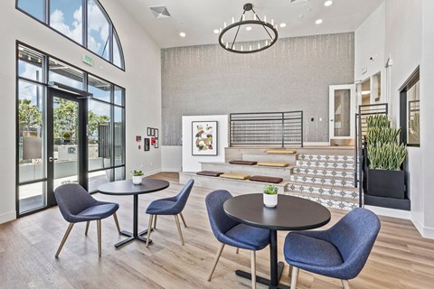 A dining area with a table and chairs.