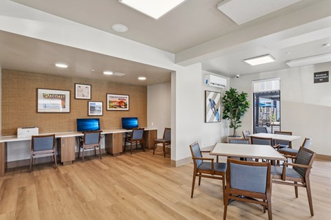 A conference room with a long table and chairs at The Orion Senior Apartments - Orange, CA Apartments, Orange, CA, 92866